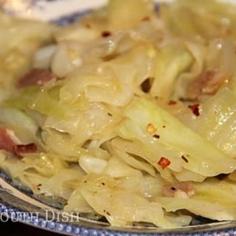 Southern Fried Cabbage ©From the Kitchen of Deep South Dish Prep time: 10 min |Cook time: 30 min | Yield: About 4 to 6 servings Ingredients 3 slices of bacon 4 tablespoons of butter, divided 1 cup of chopped onion 1 medium to large head of cabbage, chopped (about 10 to 12 cups) 1 teaspoon of kosher salt 1/4 teaspoon of freshly cracked black pepper 1/4 teaspoon of Cajun seasoning (like Slap Ya Mama), or to taste, optional 2 teaspoons of apple cider vinegar, optional Dash dried red pepper flakes, optional Instructions Chop the bacon and cook until the fat is rendered. Add 2 tablespoons of the butter and the onion and saute about 4 minutes. Add a splash of water to the bottom of the skillet to deglaze the browned bits in the bottom. Add half the cabbage, salt, pepper and Cajun seasoning, and stir. Add the remaining cabbage, stir, reduce to a low simmer, cover and cook for about 30 minutes, or until cabbage reaches the desired consistency, stirring several times. Stir in the remaining 2 tablespoons of butter and the cider vinegar. Taste and adjust salt and pepper, and sprinkle with red pepper flakes, if desired. Serve as a side dish, along with some skillet cornbread.